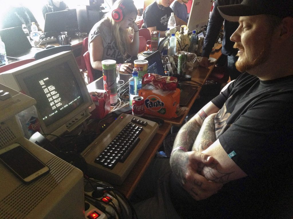 A C64 being used for programming at a demo party in 2017.